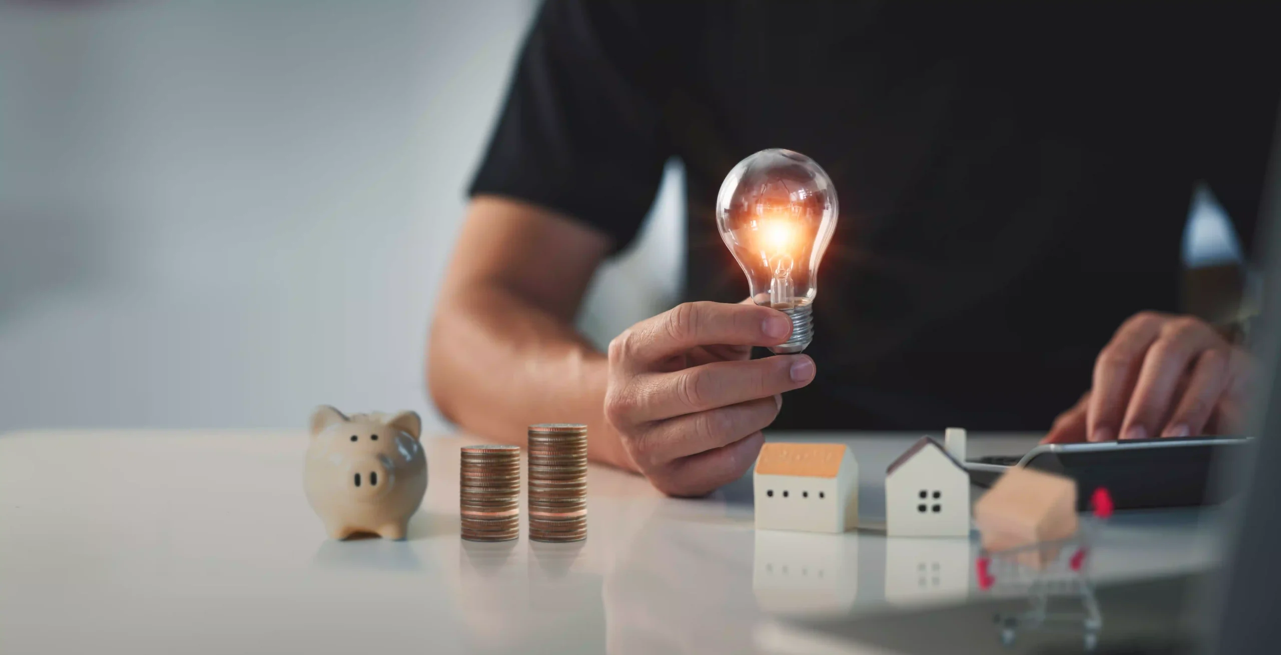 Lovepik com 480030911 Man hand holding lightbulb concept financial background. Businessman accountant and saving money r scaled